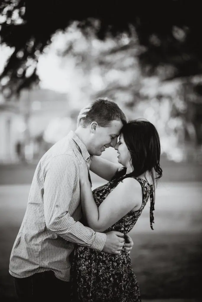 Black and white posed photo during an engagement shoot