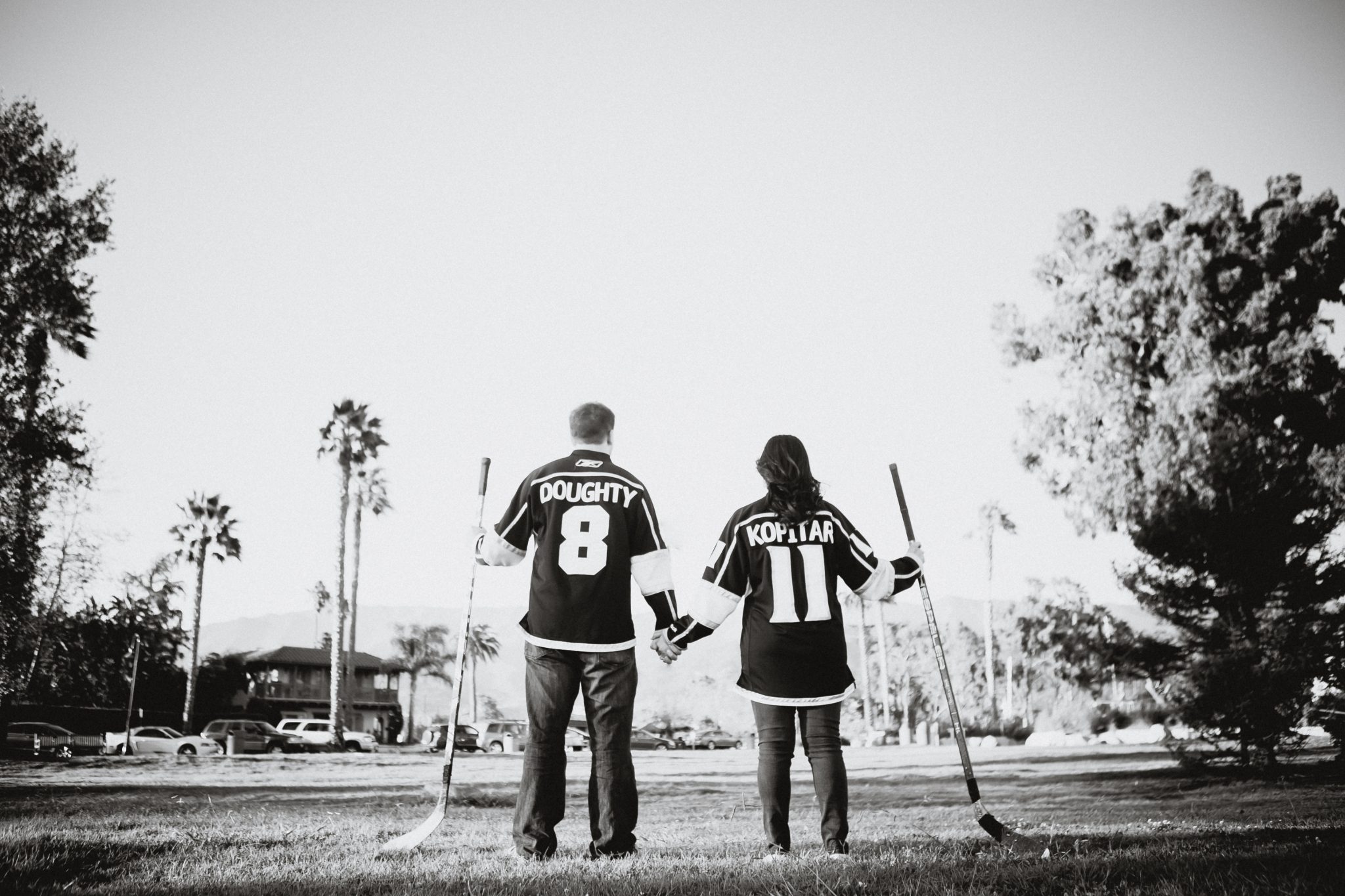 Couple wearing hockey jerseys during engagement pictures