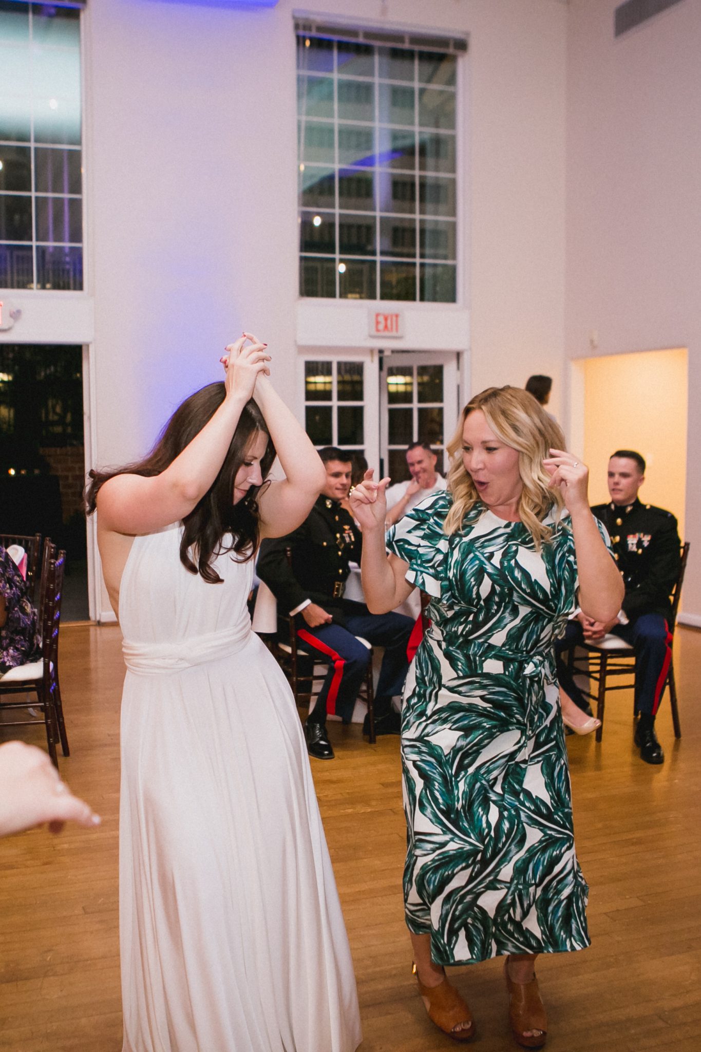 Bride dancing with her arms in the air