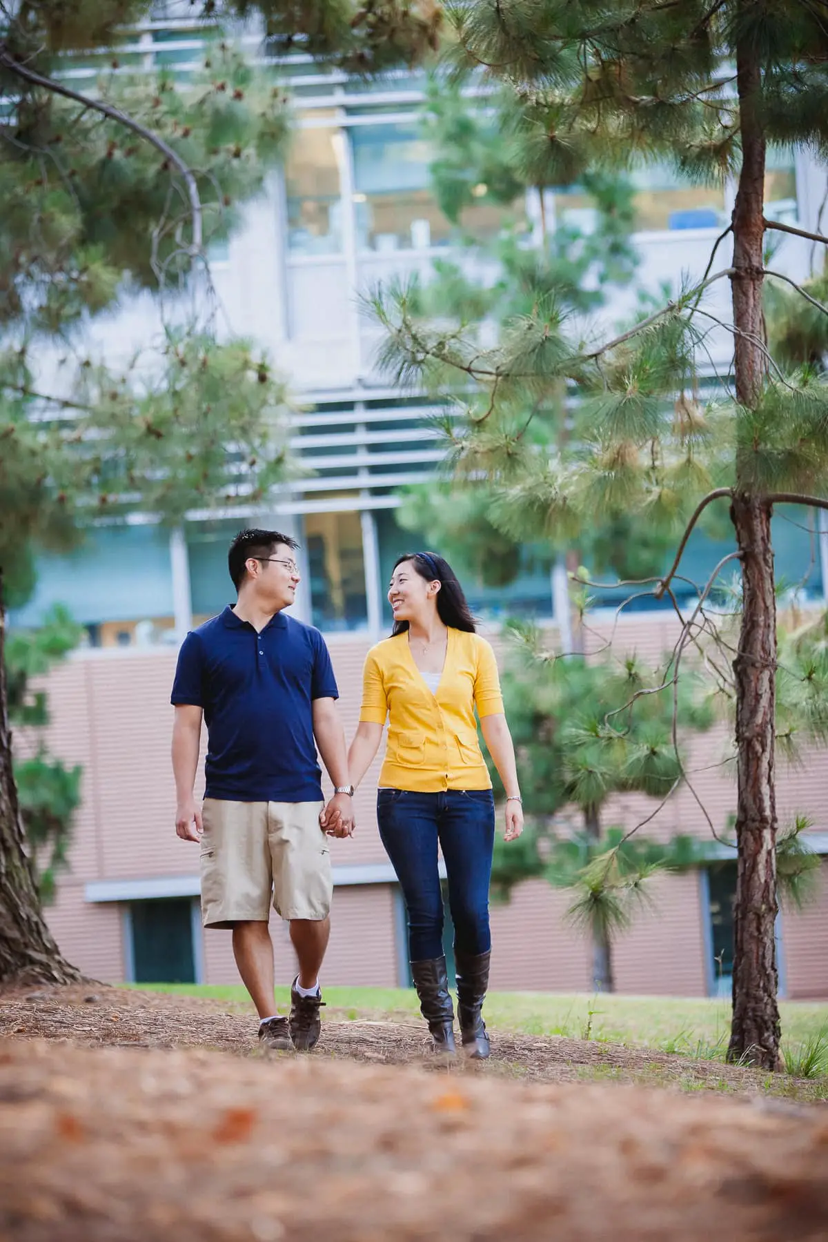 Engaged couple walking together through UCSD for their engagement session