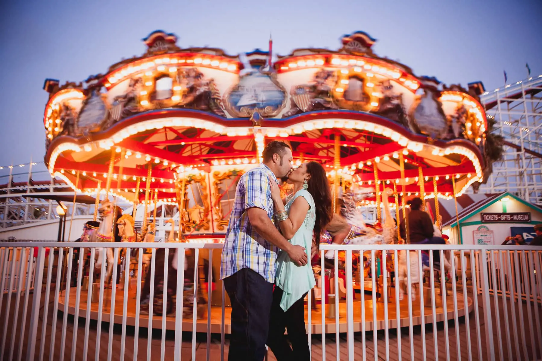 San Diego evening engagement session at Belmont Park with the merry-go-round