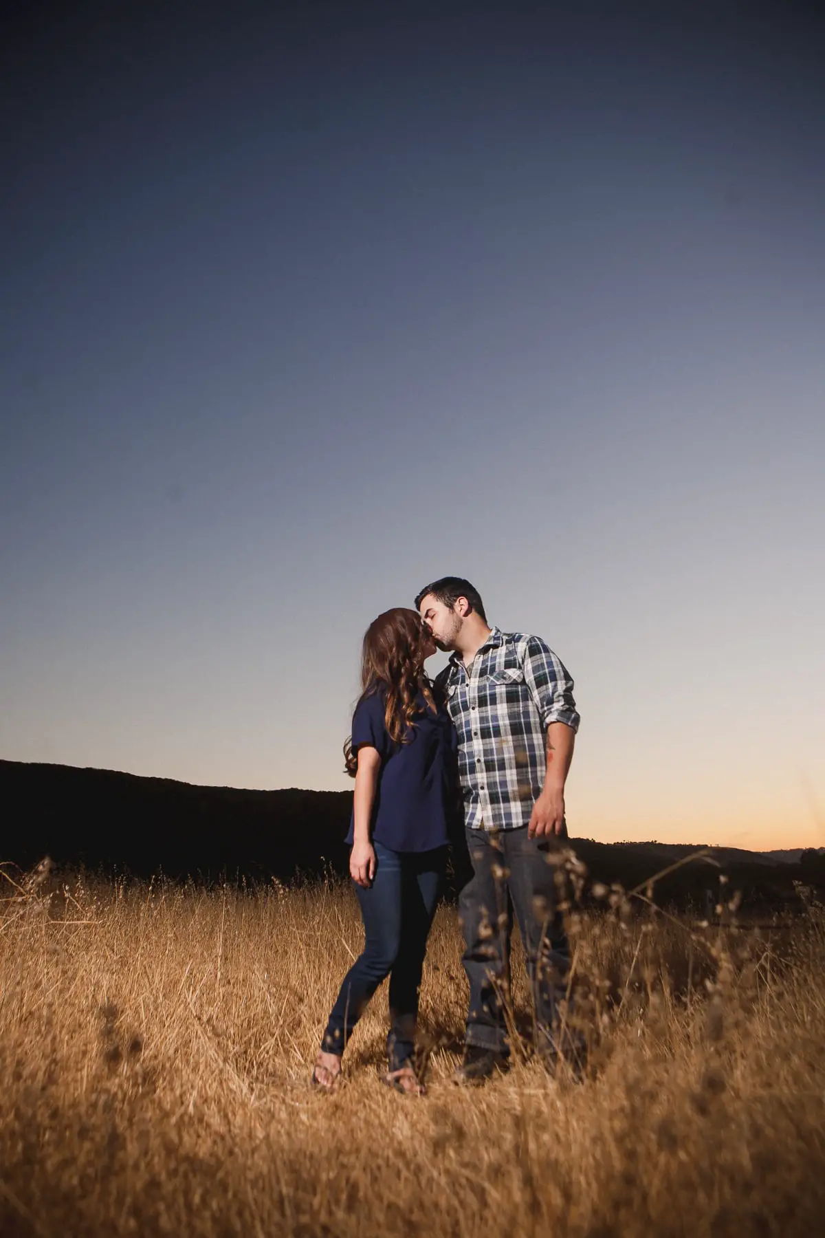 Engagement session in San Diego in a field