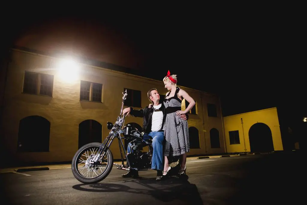 Couple sitting on a motorcycle for their engagement photos