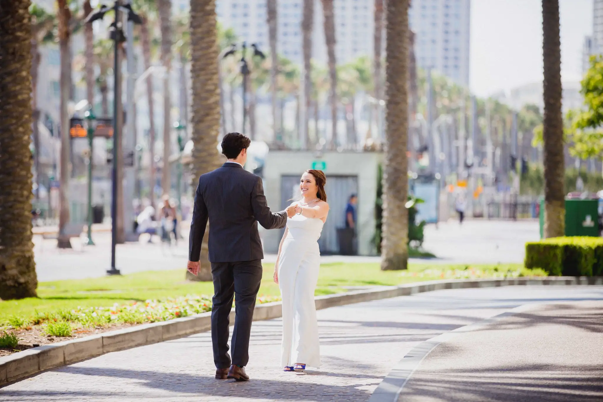 Wedding couple dancing in the street in San Diego