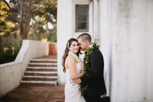 Bride and groom couple portrait with Hawaiian leis