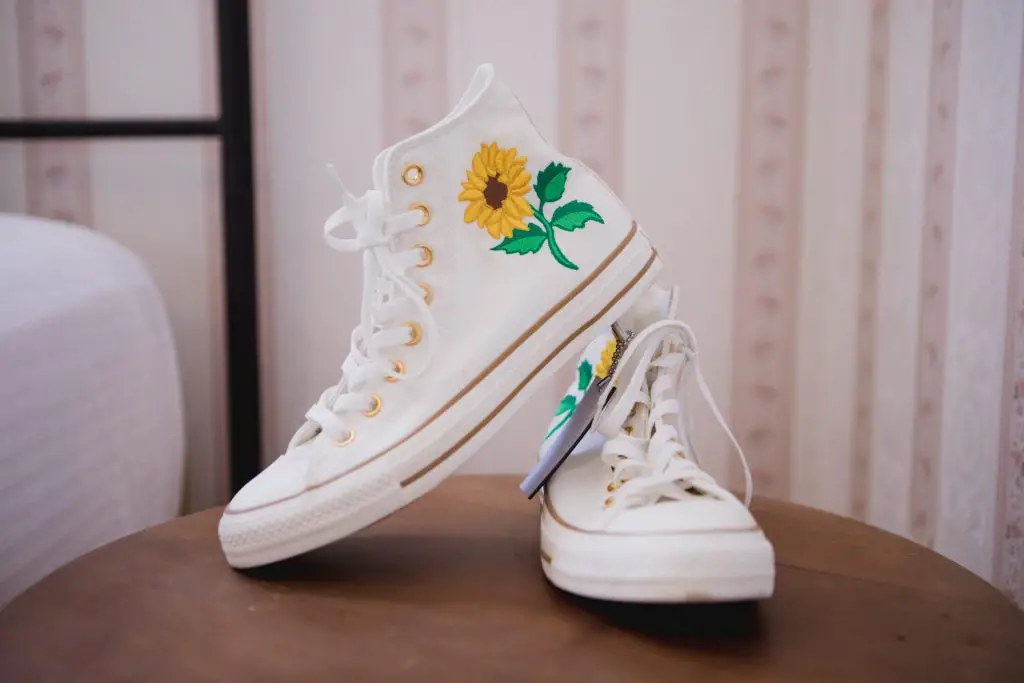 Converse wedding shoes with a sunflower on them