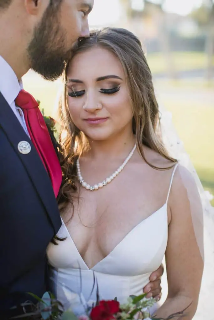 Bride with a big bust wearing a v-neck wedding dress